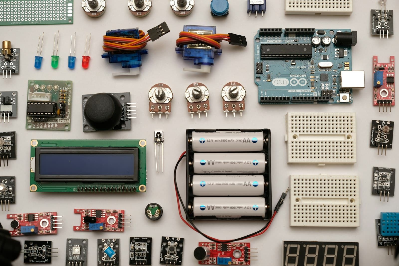Electronic components and a development board laid out on a table