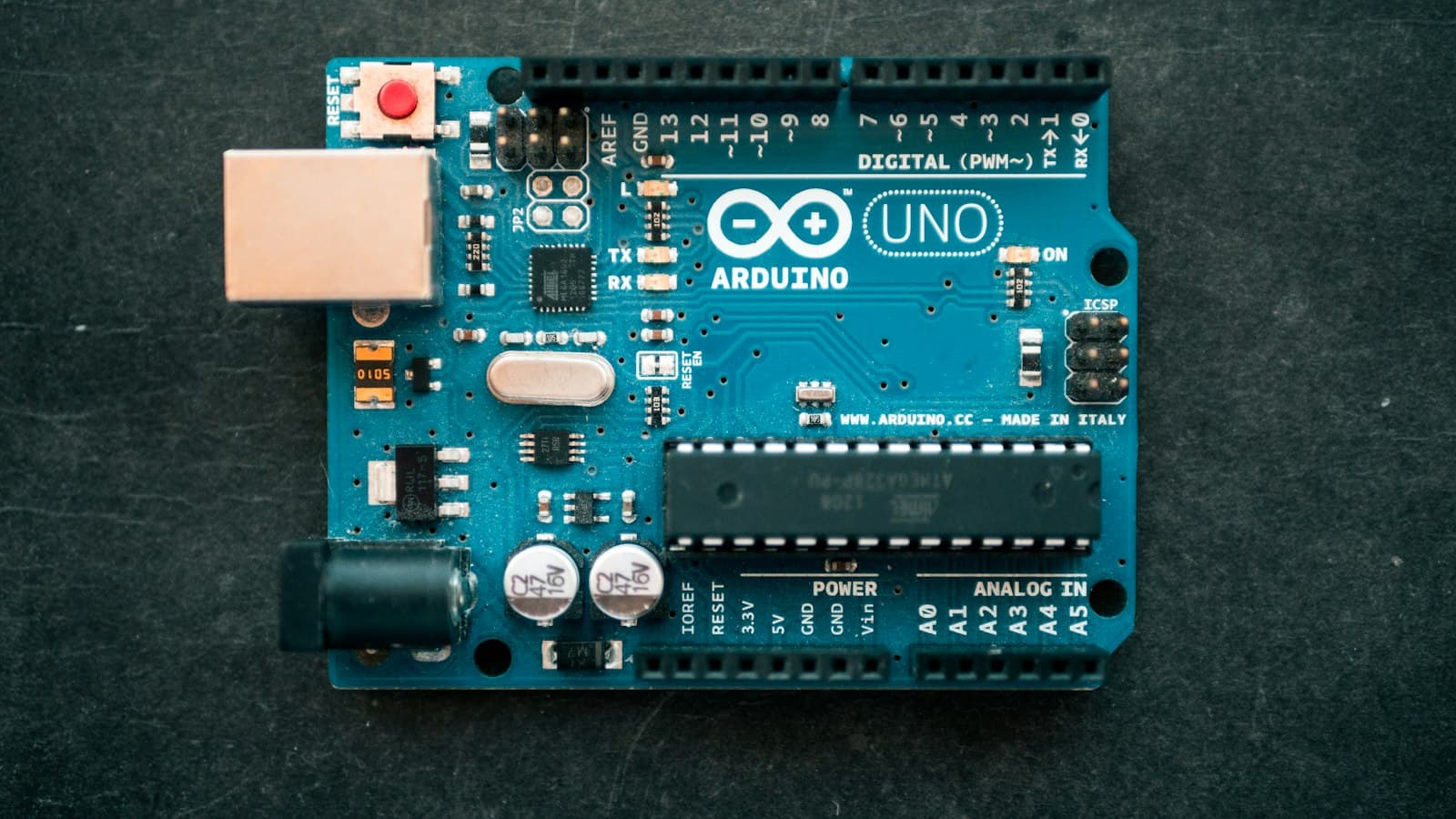 A microcontroller development board on a desk